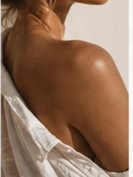 Sun-kissed profile with an even, believable tan